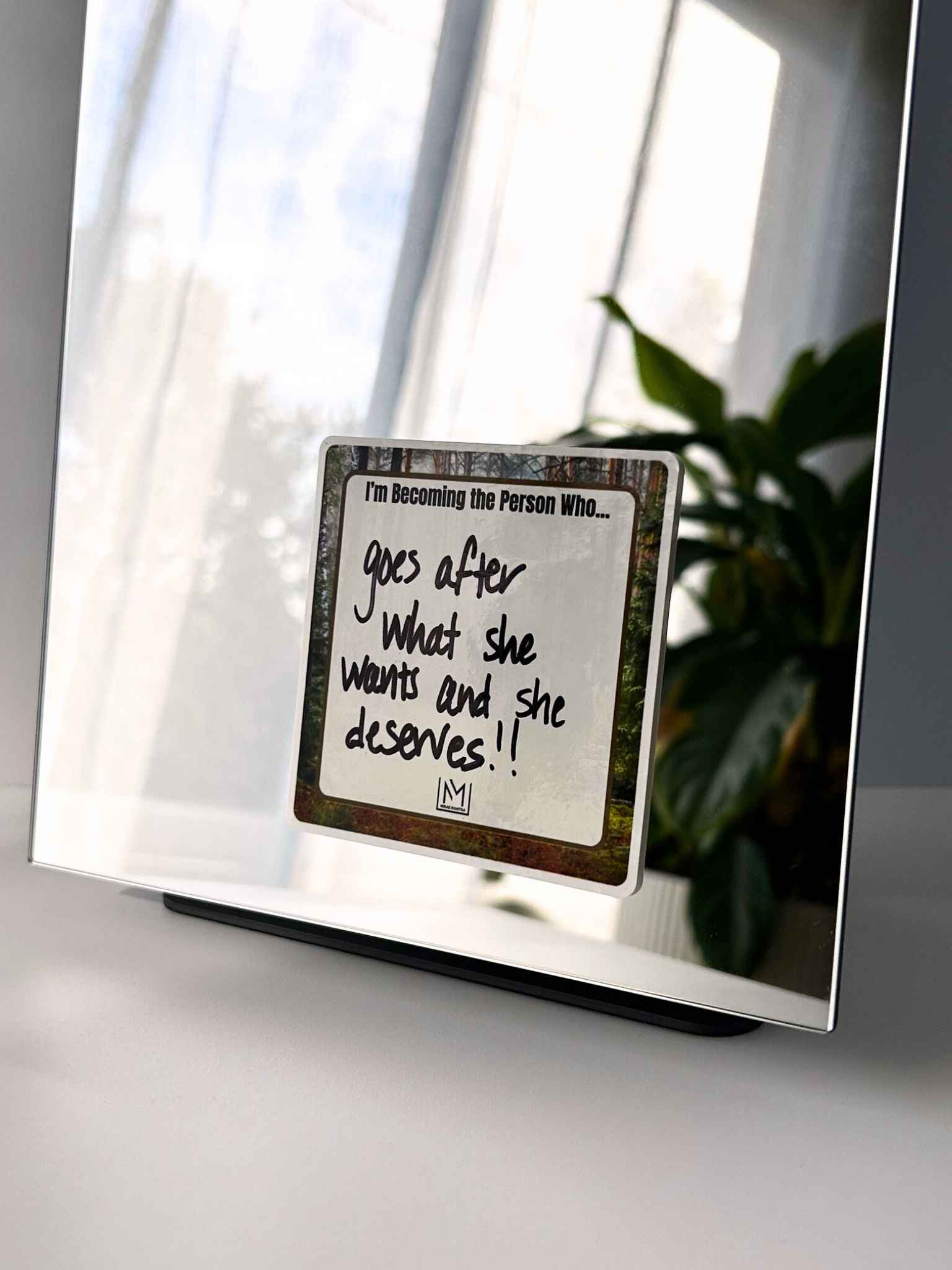 Customizable mirror affirmation reading “I’m becoming the person who…”